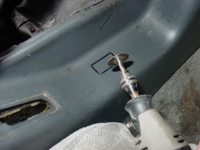 Dremel cutting new switch hole