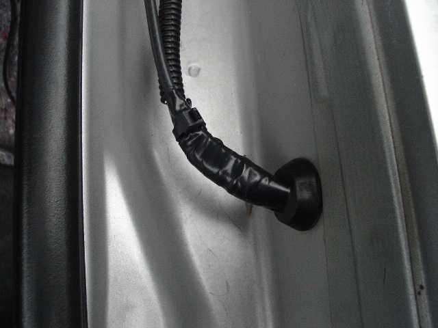 Antenna coax trough grommet
