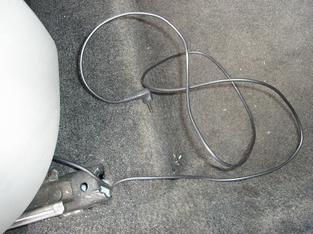 Speaker wire from under seat