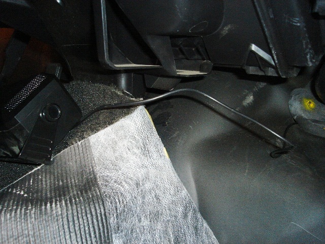 Speaker wire under padding
