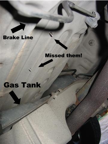 Under car picture showng screws poking out