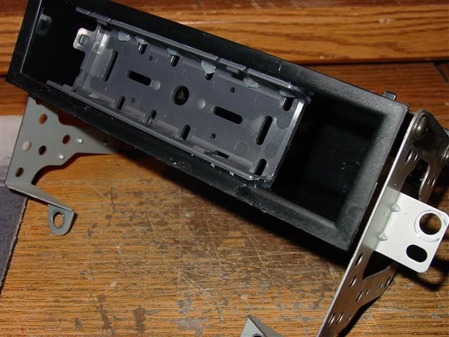 Attaching radio bracket to dash pocket